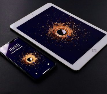 gold Apple iPad and black smartphone