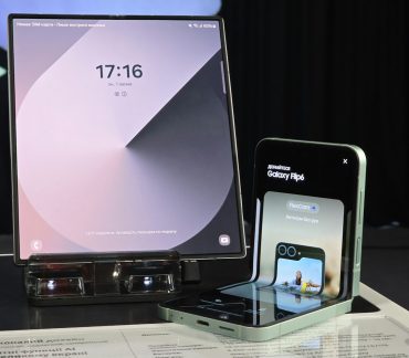 A cell phone and a laptop on a table